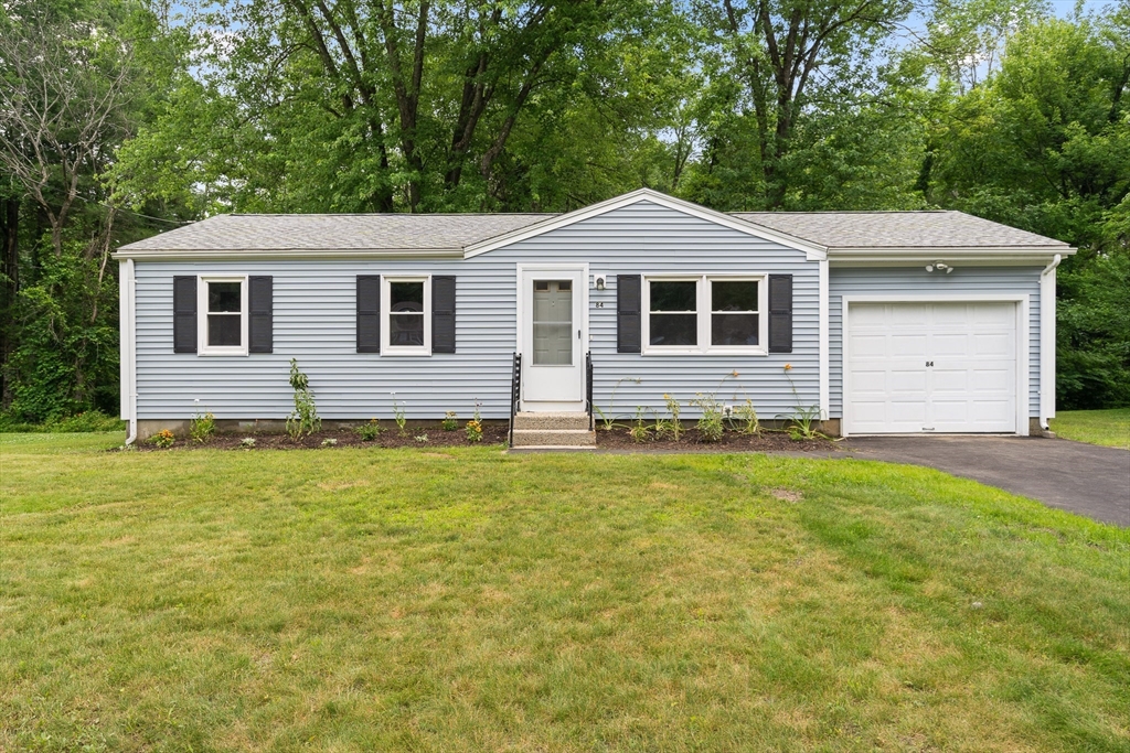 84 Sandy Hill Road Northampton, MA 01062 - Photo 1 of 33 a front view of a house with garden