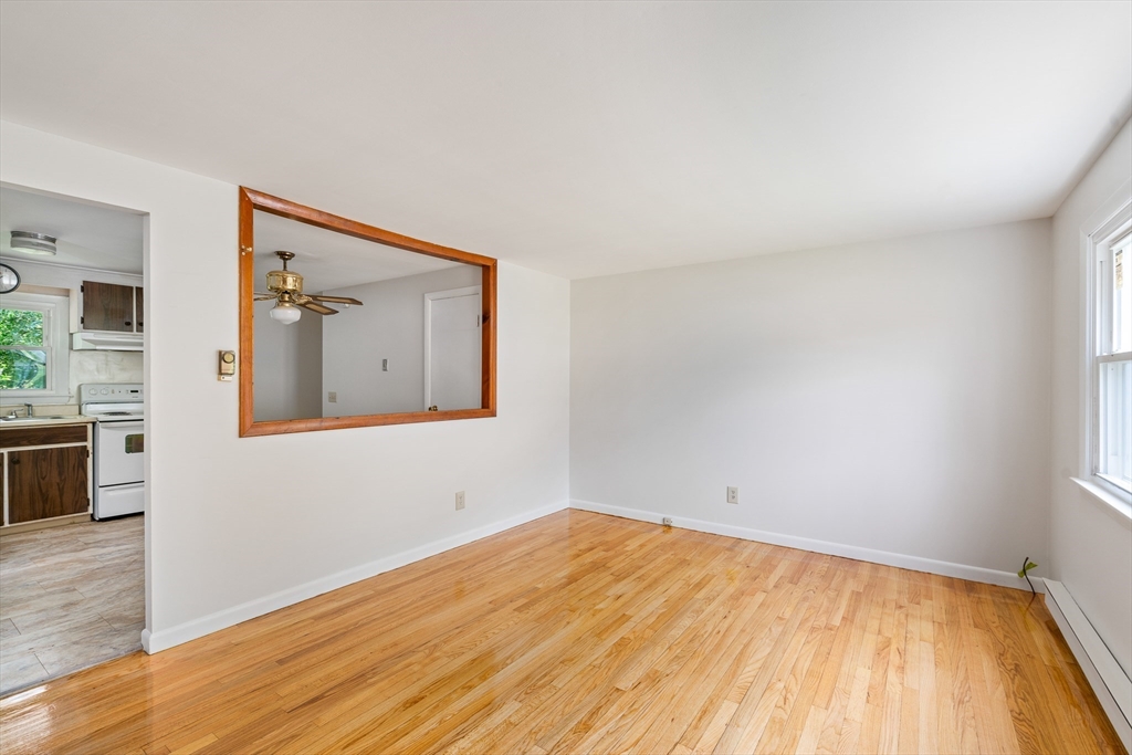 84 Sandy Hill Road Northampton, MA 01062 - Photo 5 of 33 a view of empty room with wooden floor and fan