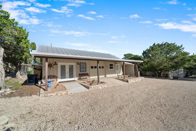 a swimming pool with yard and outdoor seating