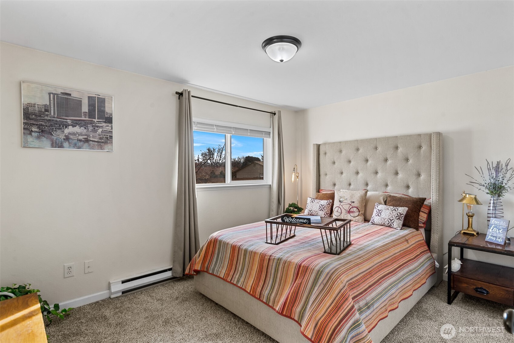 708 Cherry Court Wenatchee, WA 98801 - Photo 17 of 26 a bedroom with a bed and wooden floor