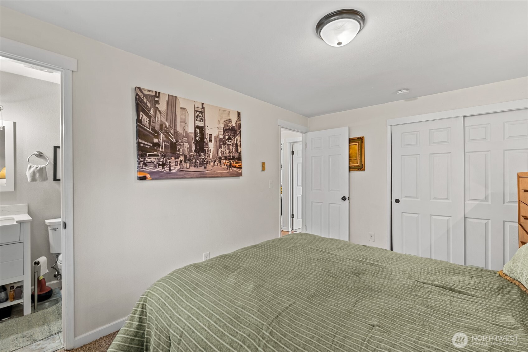 708 Cherry Court Wenatchee, WA 98801 - Photo 21 of 26 a bedroom with a bed and a painting on the wall