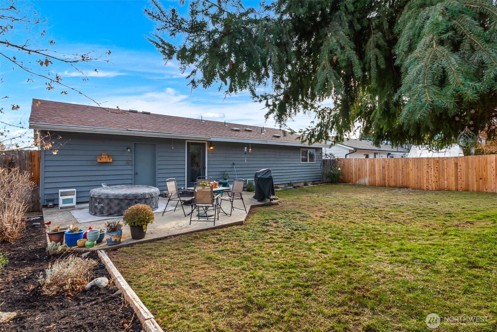 708 Cherry Court Wenatchee, WA 98801 - Photo 23 of 26 a view of a house with backyard and sitting area