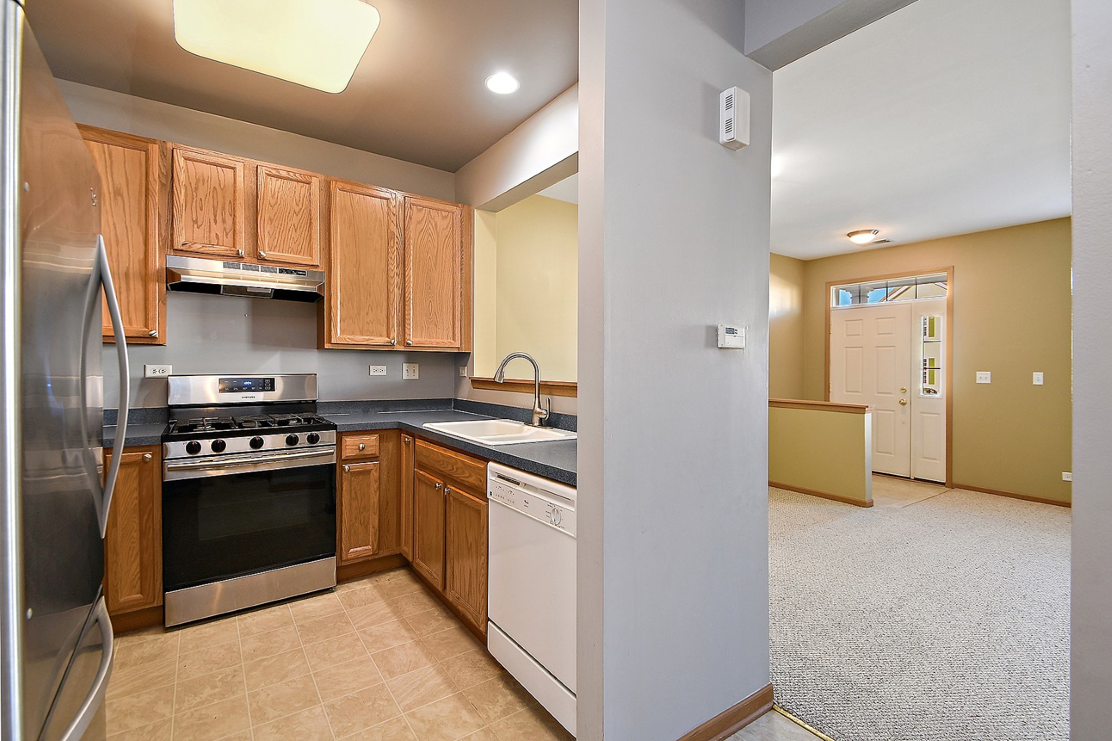 2529 Capitol Avenue Aurora, IL 60503 - Photo 7 of 25 a kitchen with stainless steel appliances granite countertop a stove and a refrigerator