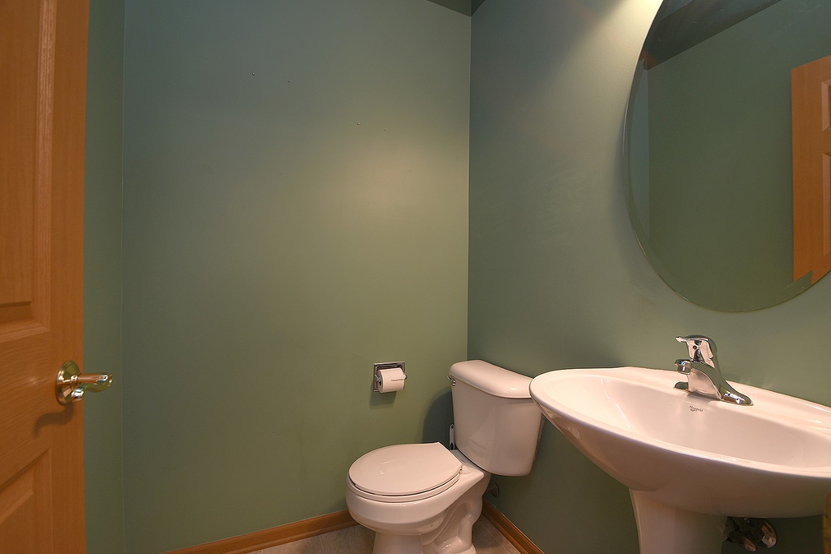 2529 Capitol Avenue Aurora, IL 60503 - Photo 9 of 25 a bathroom with a sink a toilet and a mirror
