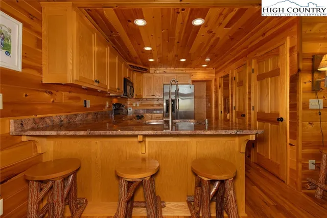 a view of a dining area with furniture and wooden floor