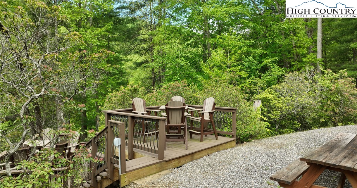 142 Fawn Lane Purlear, NC 28665 - Photo 43 of 49 a view of a dinning tables and chairs in a patio