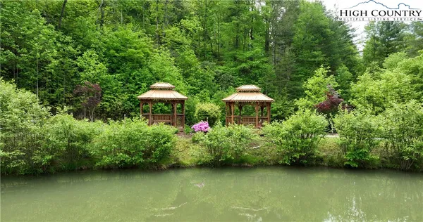 an aerial view of residential house with an outdoor space and street view