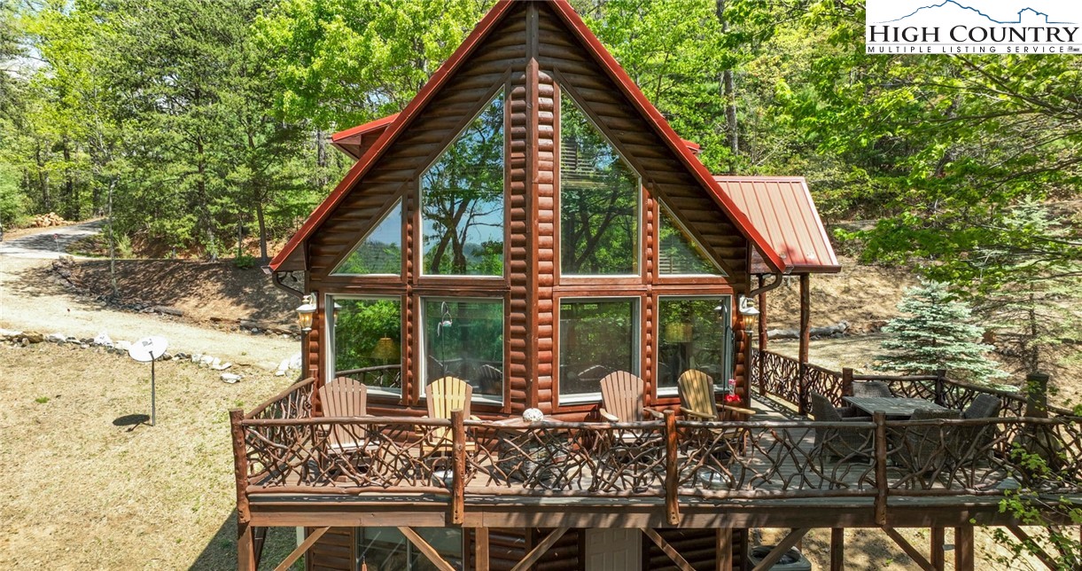 142 Fawn Lane Purlear, NC 28665 - Photo 8 of 49 a front view of a house with garden