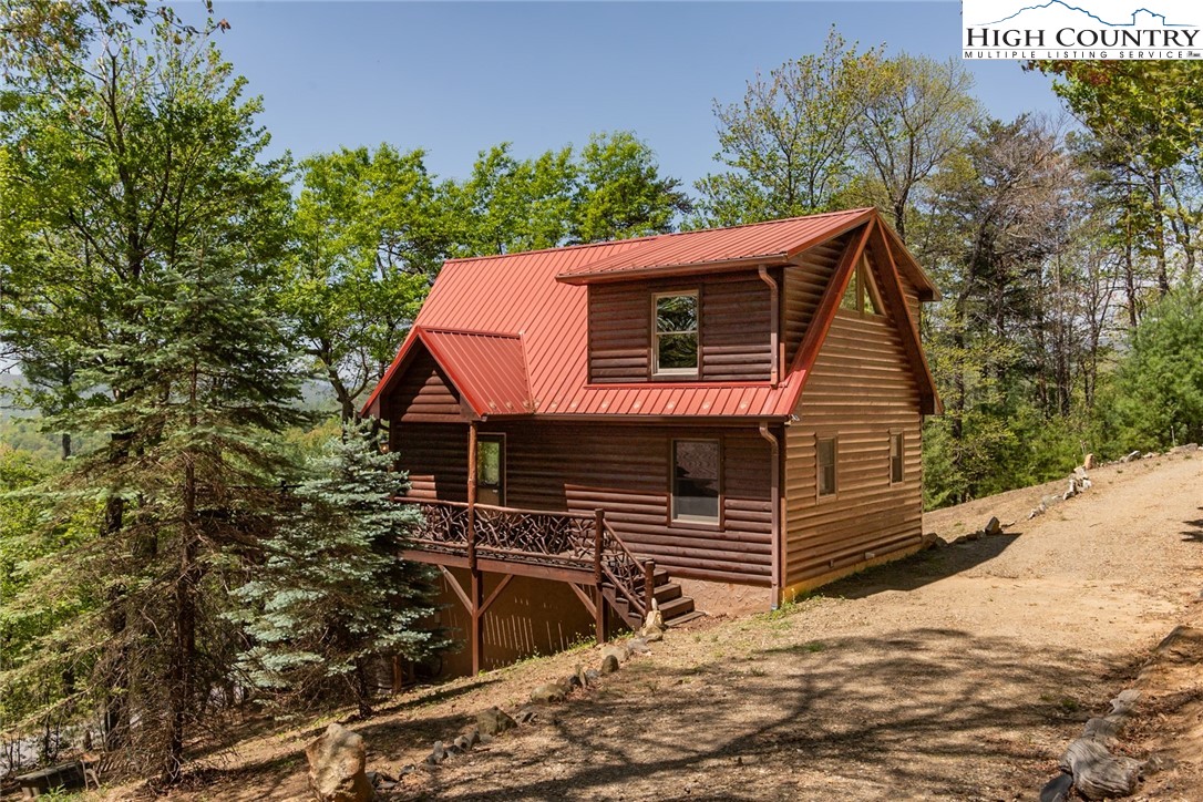 142 Fawn Lane Purlear, NC 28665 - Photo 9 of 49 a view of a house with a yard