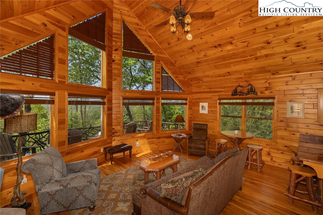 142 Fawn Lane Purlear, NC 28665 - Photo 10 of 49 a living room with furniture a large window with outer view