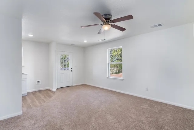 a view of an empty room with a window