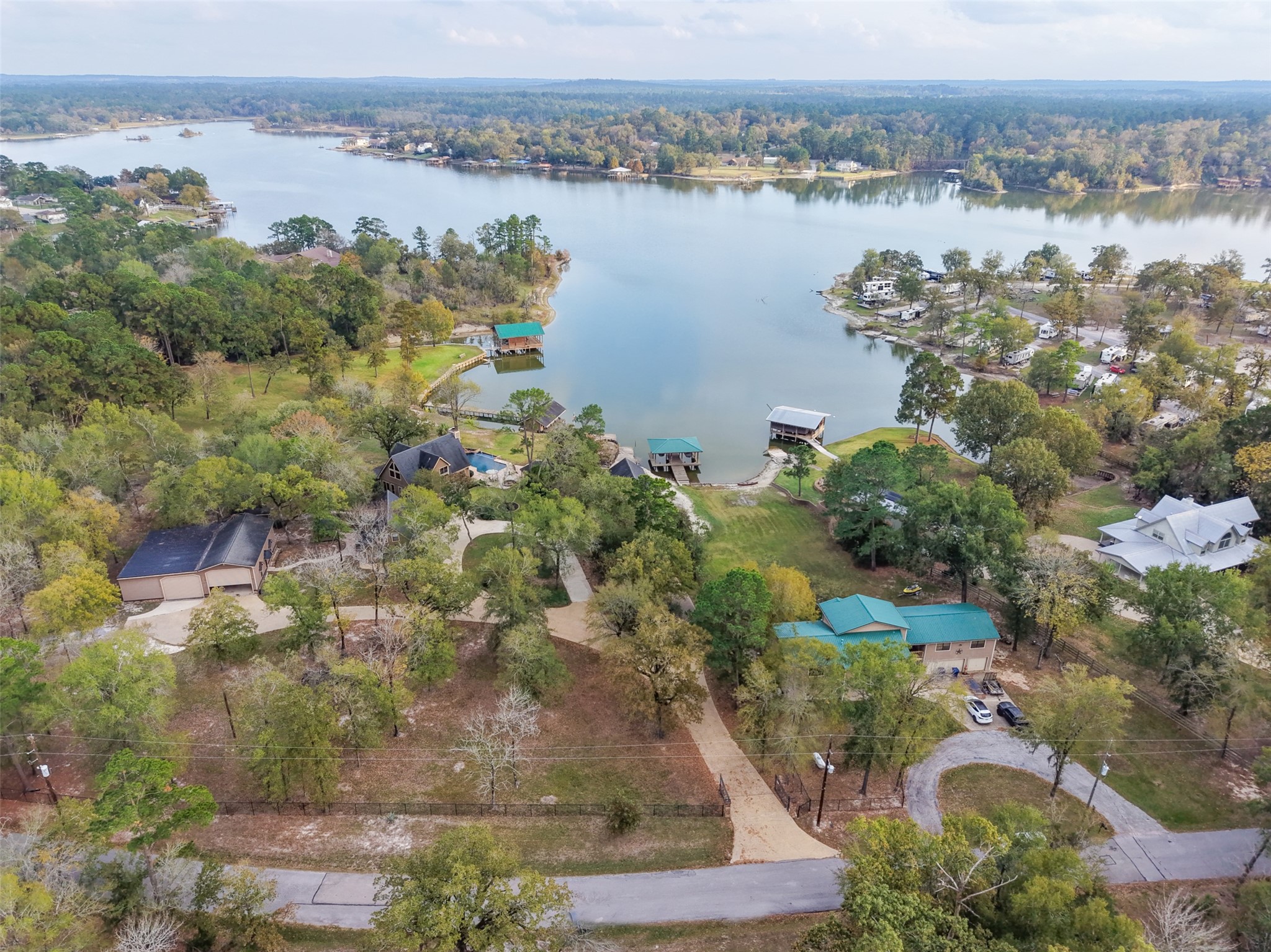 186 Lake Road Huntsville, TX 77320 - Photo 46 of 48 an aerial view of lake and residential houses with outdoor space