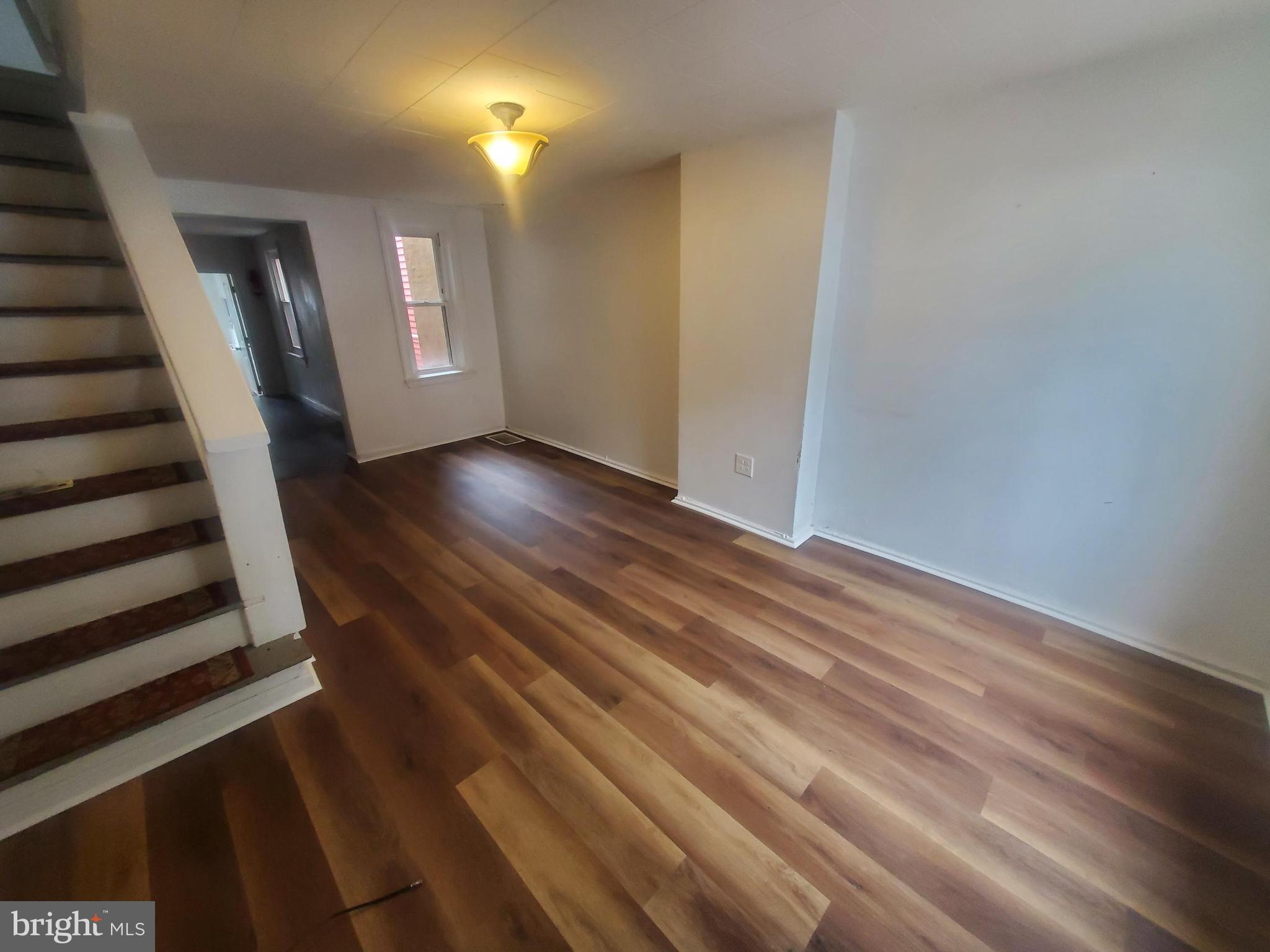 404 South 9th Street Reading, PA 19602 - Photo 3 of 11 wooden floor in an empty room