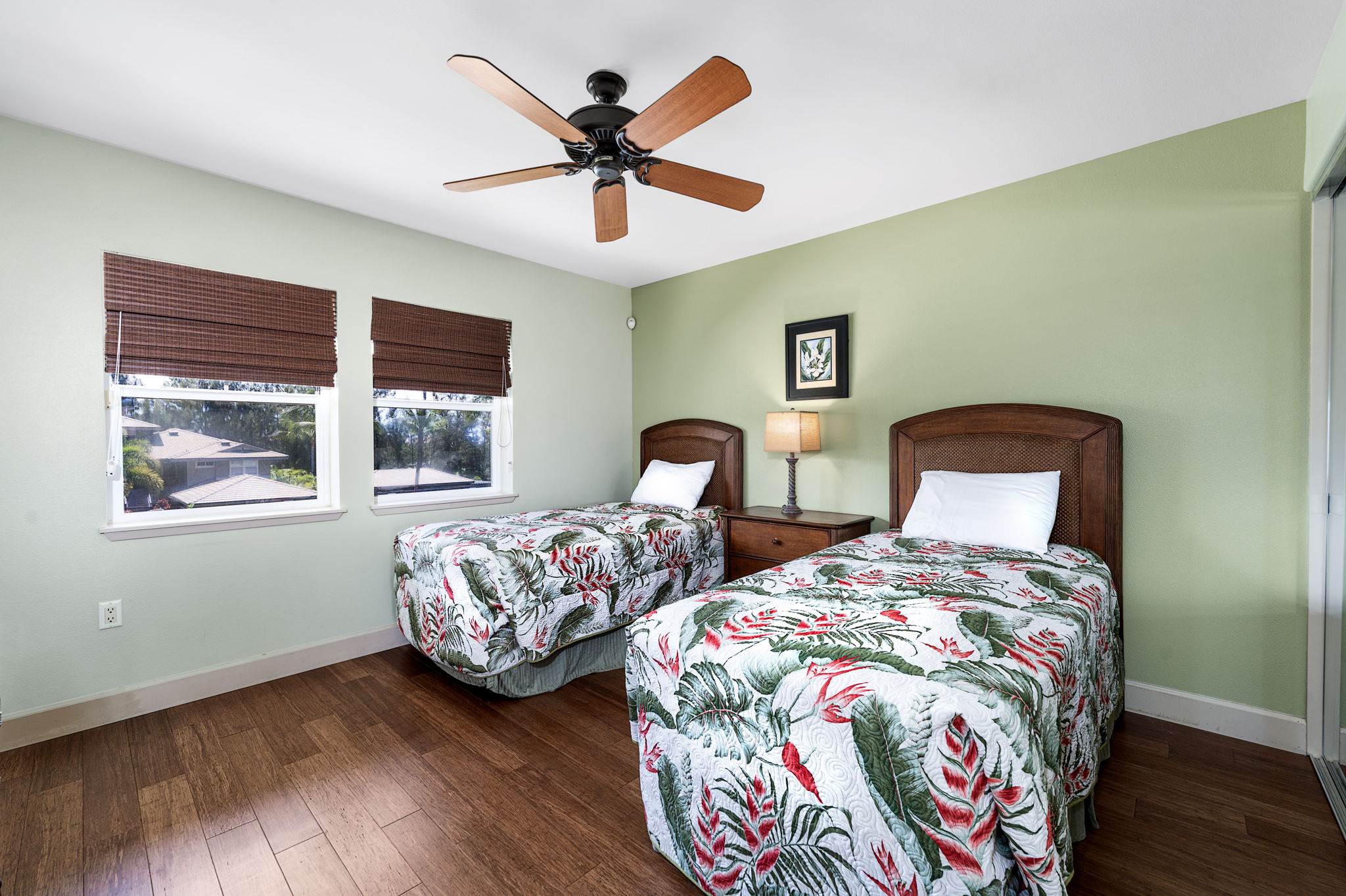 69-1033 Nawahine Place, Unit 22G Waikoloa, HI 96738 - Photo 15 of 30 a bedroom with two beds and wooden floor