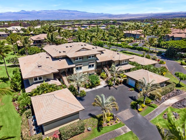 an aerial view of a house with a garden