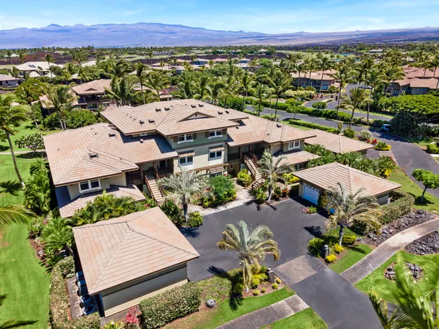 an aerial view of a house with a garden