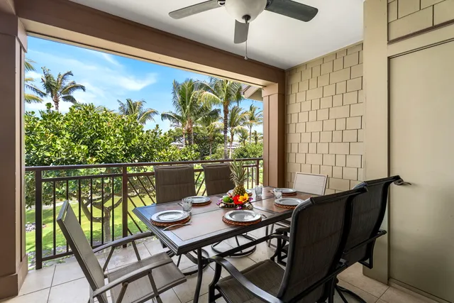 a view of a balcony dining table and chairs with wooden floor