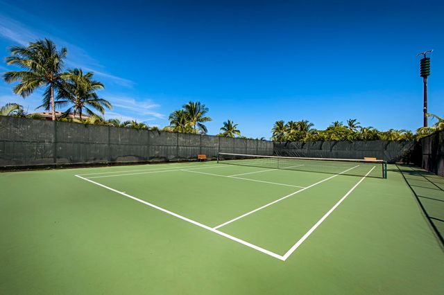 a view of an outdoor space and tennis court
