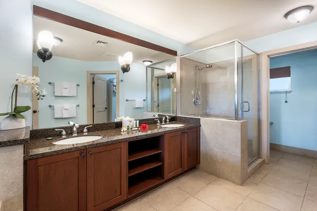 a bathroom with a double vanity sink mirror and double