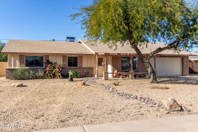 a view of a house with snow on the road