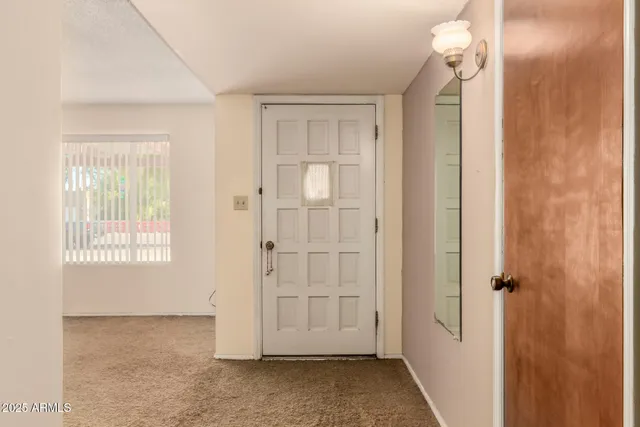 a view of an empty room with a window