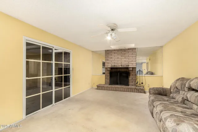 a view of livingroom with furniture and a fireplace