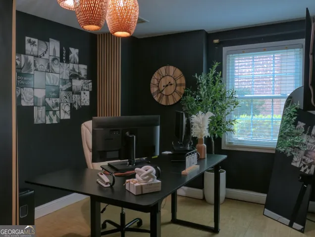 a view of a dining room with furniture and chandelier