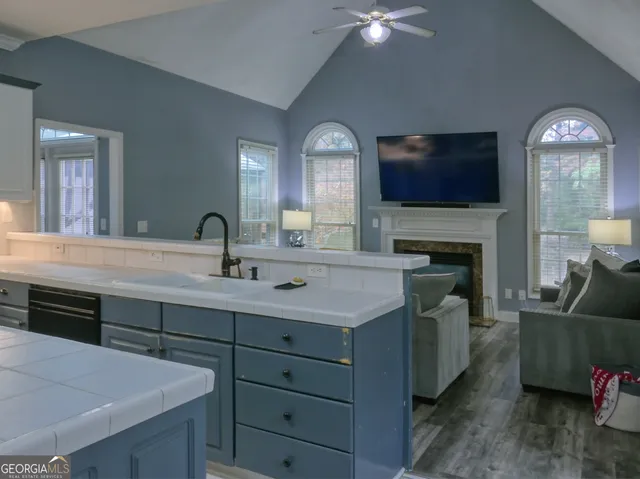 a kitchen with a sink and a fireplace