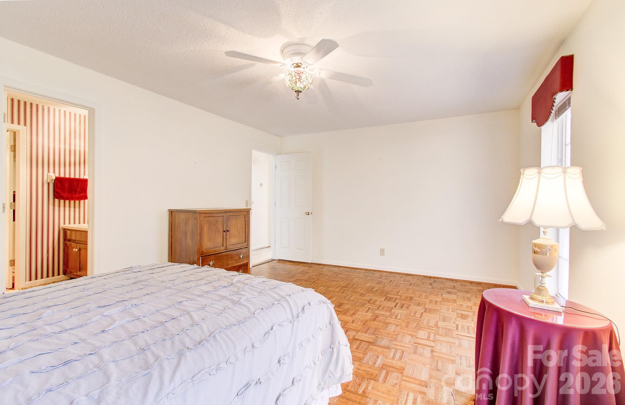456 Mills Gap Road Arden, NC 28704 - Photo 14 of 43 a bedroom with a bed and a window