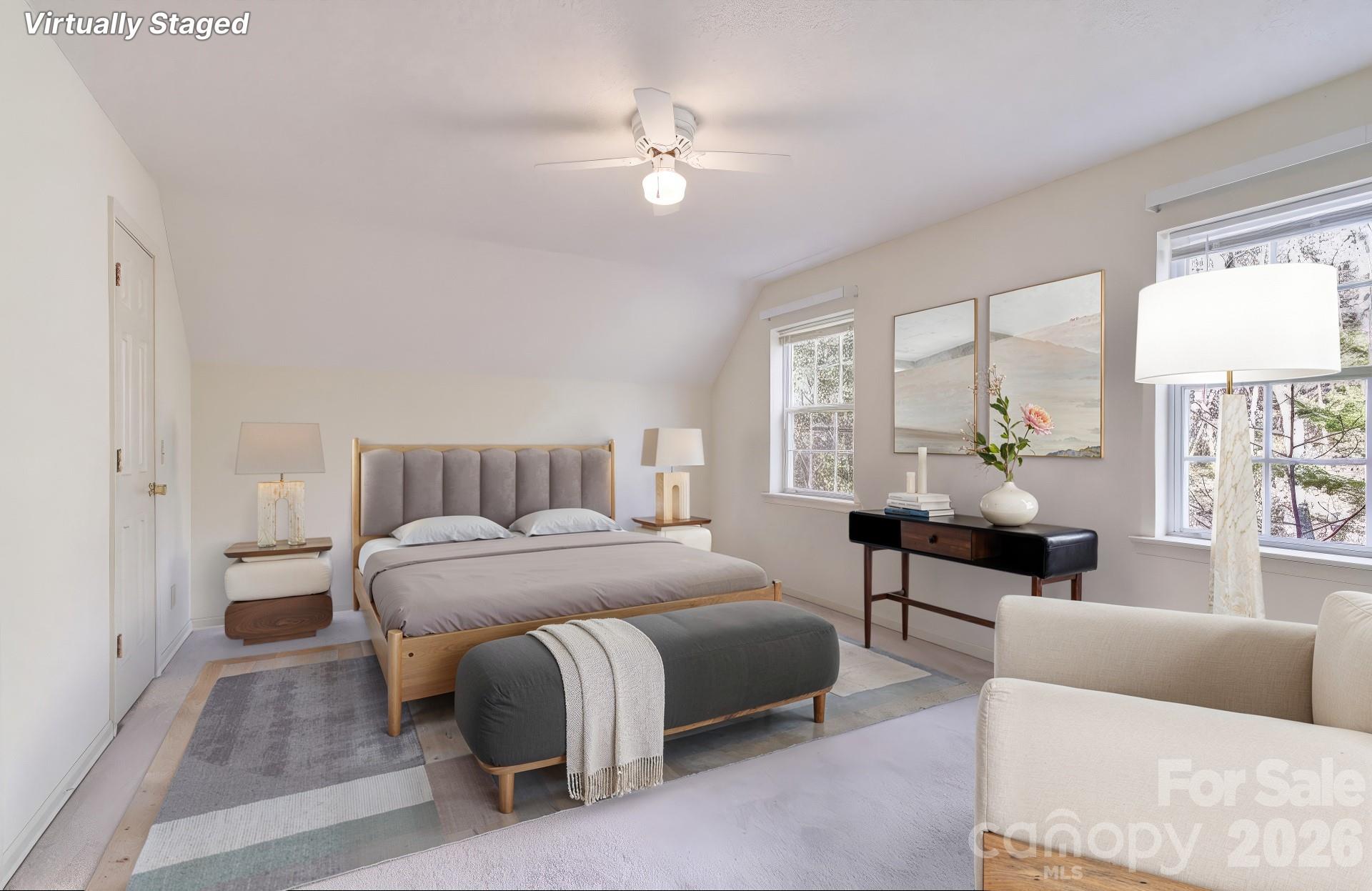 456 Mills Gap Road Arden, NC 28704 - Photo 3 of 43 a bedroom with a bed a couch and a large window
