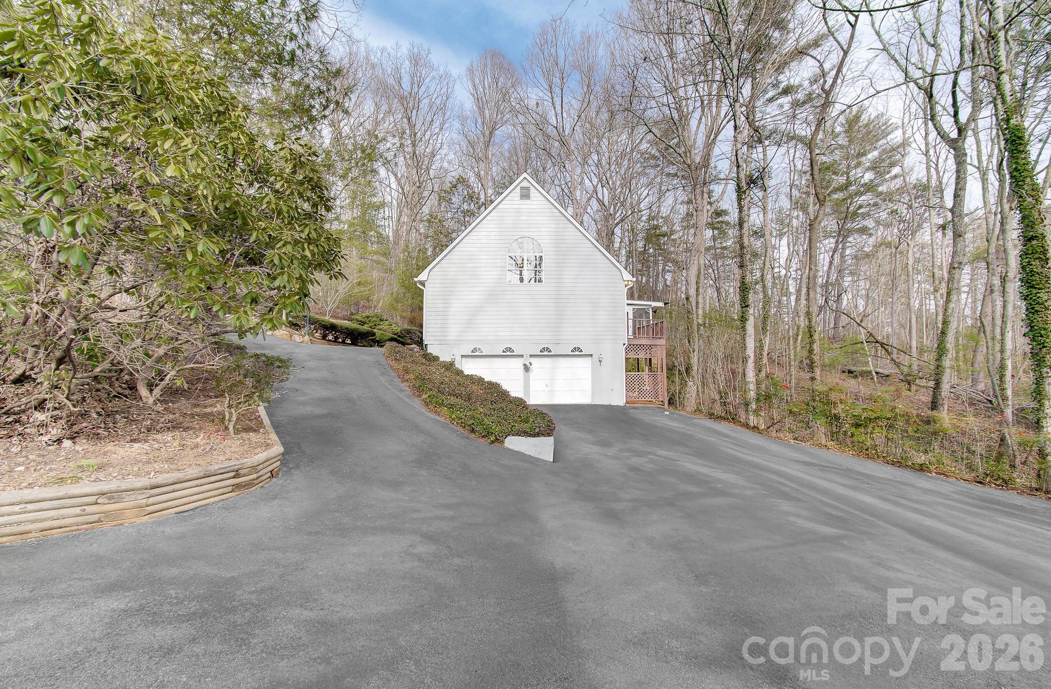 456 Mills Gap Road Arden, NC 28704 - Photo 42 of 43 a view of backyard with a garden and trees