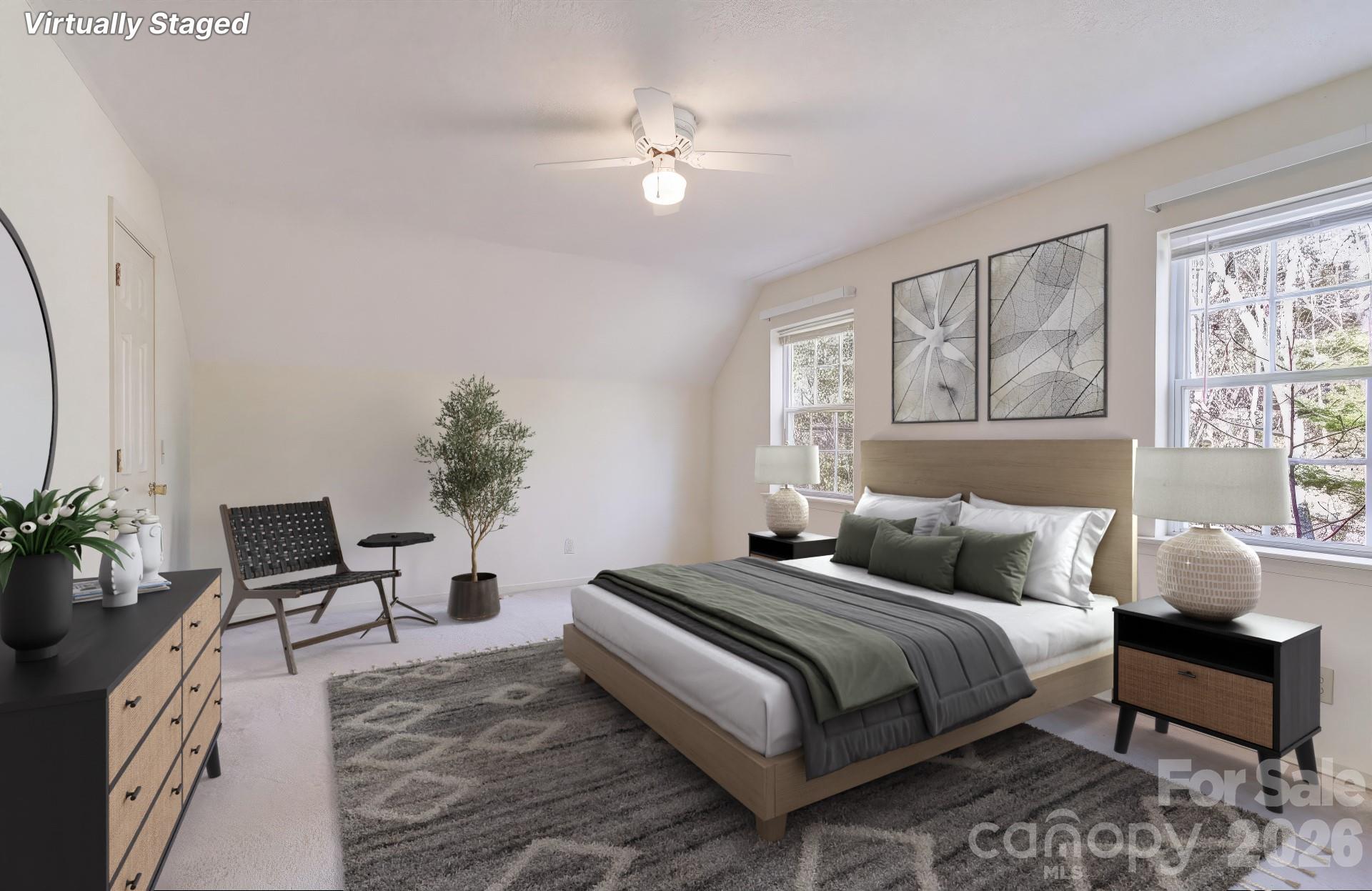 456 Mills Gap Road Arden, NC 28704 - Photo 6 of 43 a bedroom with a large bed and a chandelier