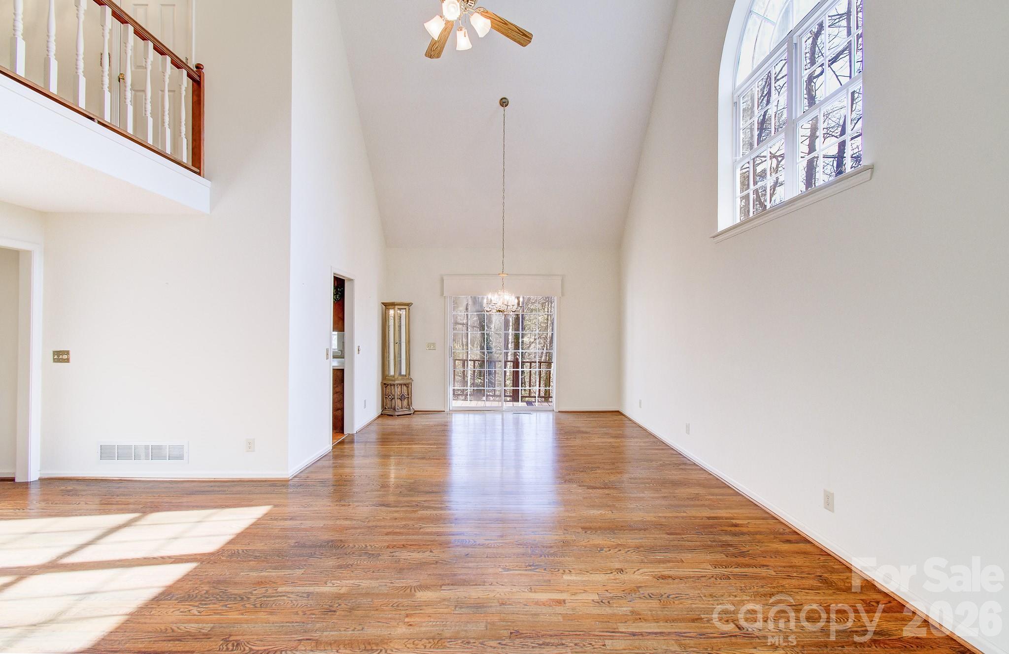 456 Mills Gap Road Arden, NC 28704 - Photo 8 of 43 a view of an empty room with wooden floor