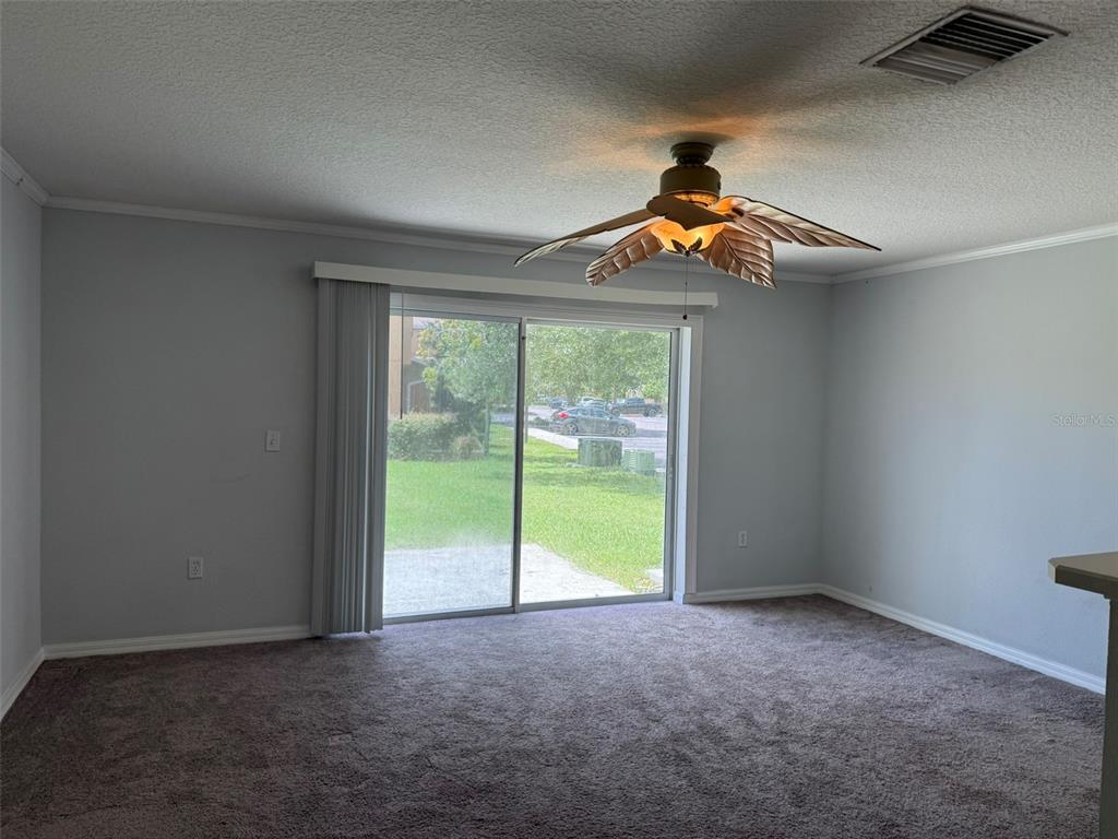 6907 Marble Fawn Place Riverview, FL 33578 - Photo 7 of 11 wooden floor in an empty room with a window