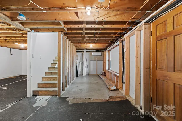 a view of an empty room with windows