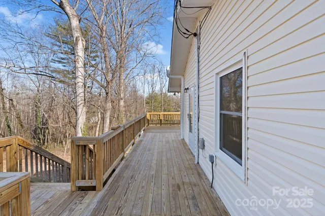 a view of balcony with wooden floor