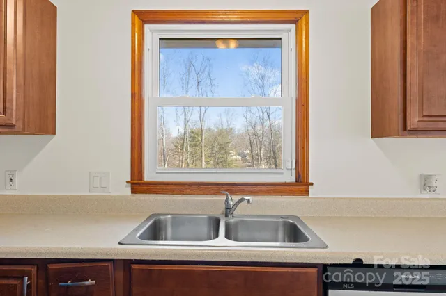 a kitchen with a sink and a window