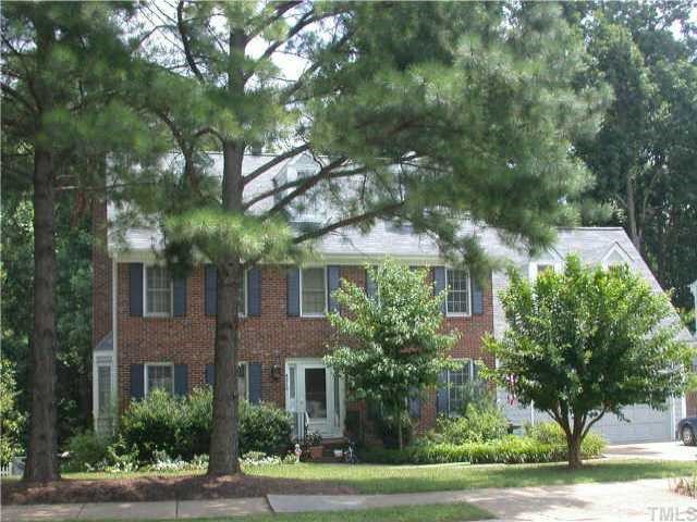 8212 Mourning Dove Road Raleigh, NC 27615 - Photo 1 of 1 a front view of a multi story building with yard