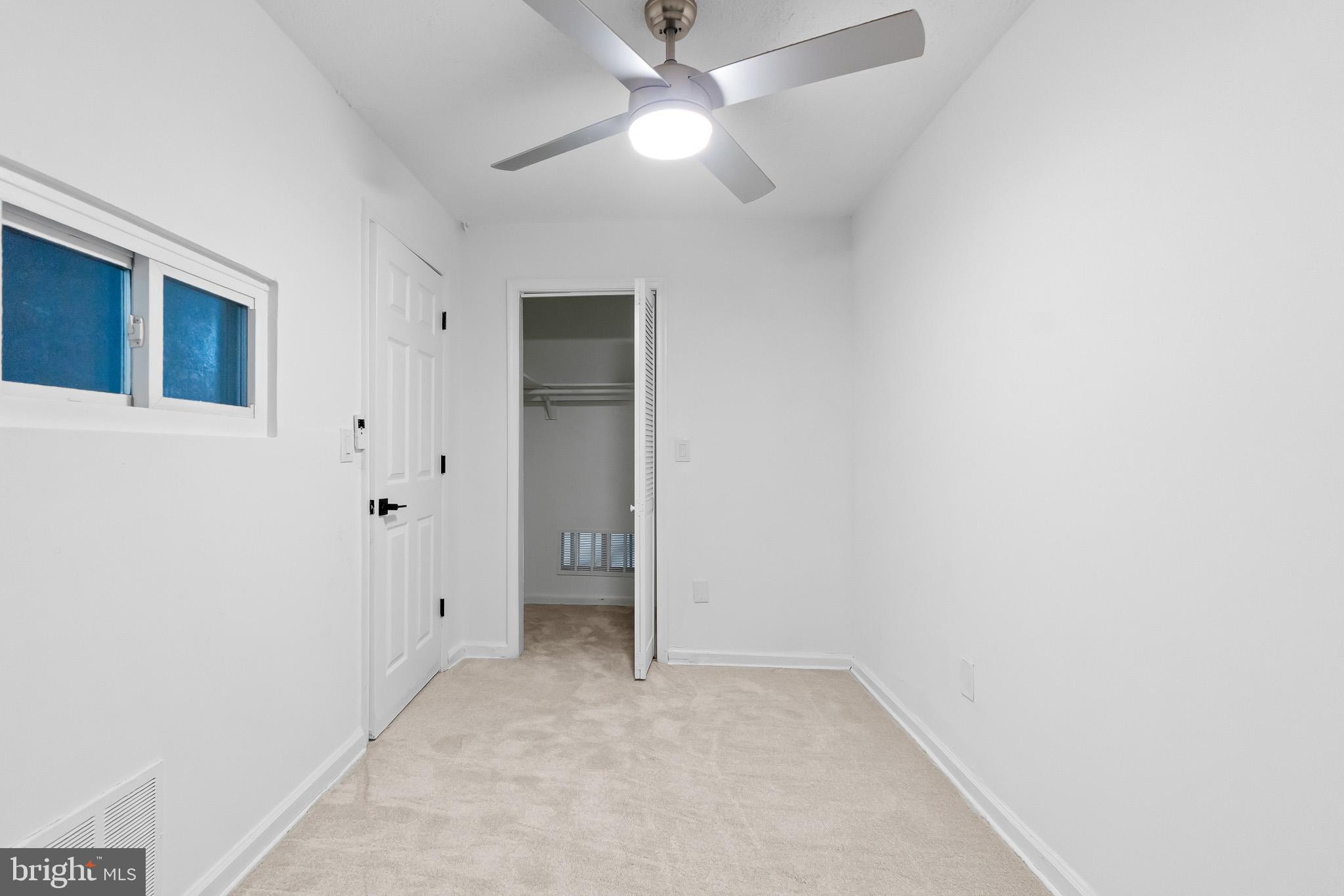 7975 Riggs Road, Unit 4 Hyattsville, MD 20783 - Photo 21 of 22 an empty room with closet and a ceiling fan