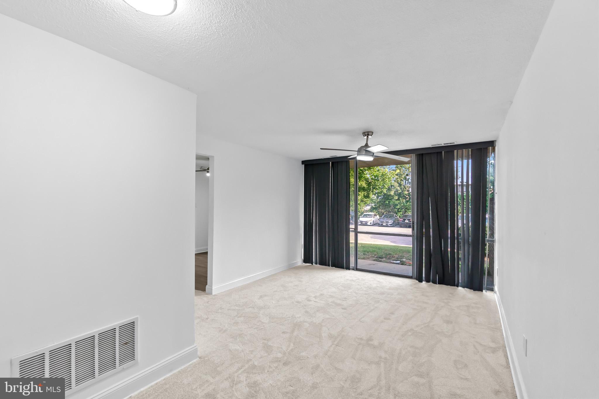 7975 Riggs Road, Unit 4 Hyattsville, MD 20783 - Photo 4 of 22 a view of an empty room with a window