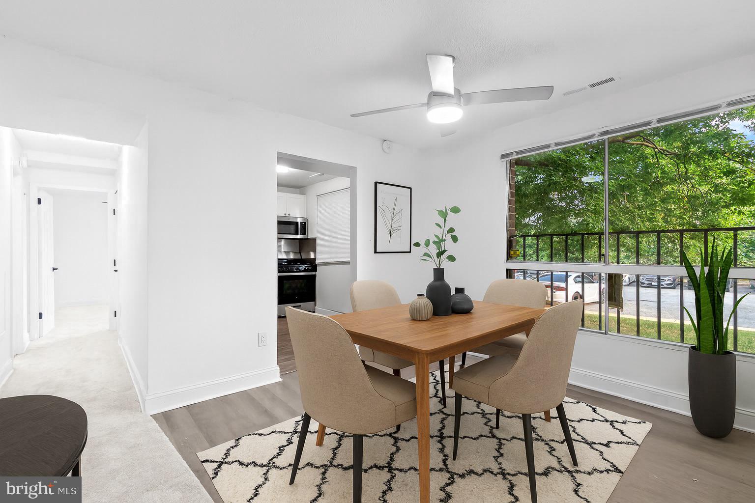 7975 Riggs Road, Unit 4 Hyattsville, MD 20783 - Photo 9 of 22 a view of a dining room with furniture window and outside view