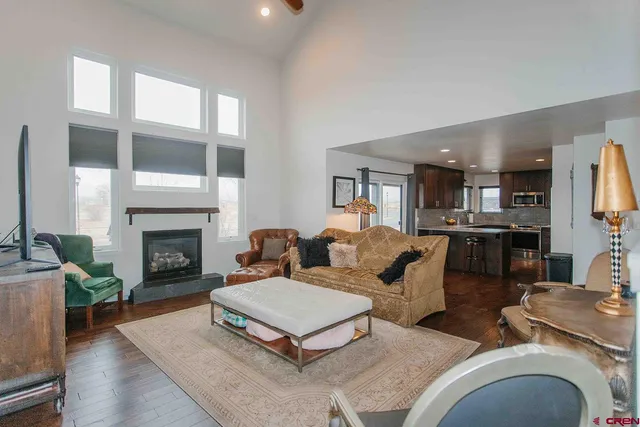 a living room with furniture fireplace and flat screen tv