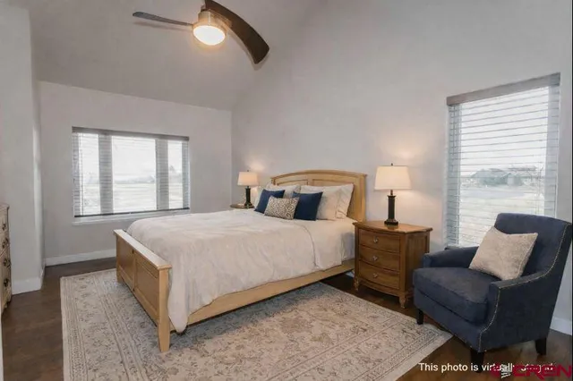 a bedroom with a bed couch and window