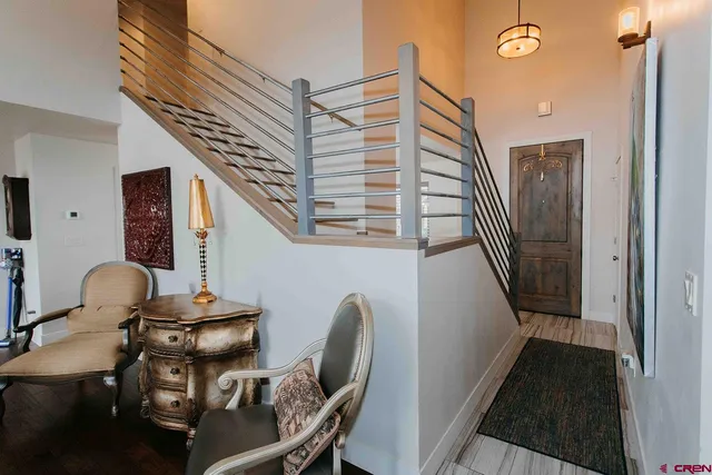 a view of a hallway with chairs