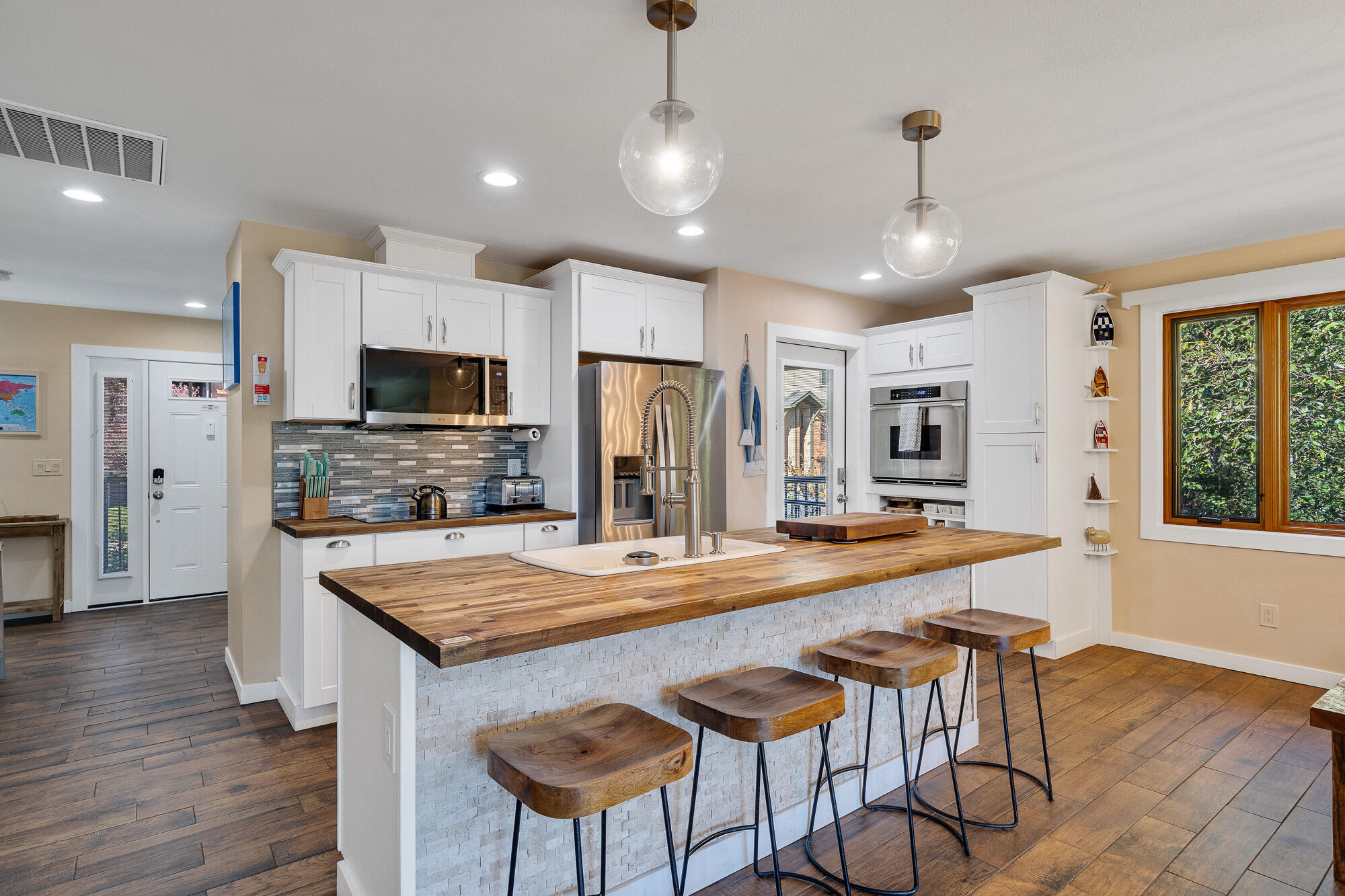 13150 D Street Nehalem, OR 97131 - Photo 9 of 29 a large kitchen with kitchen island a large island in the center