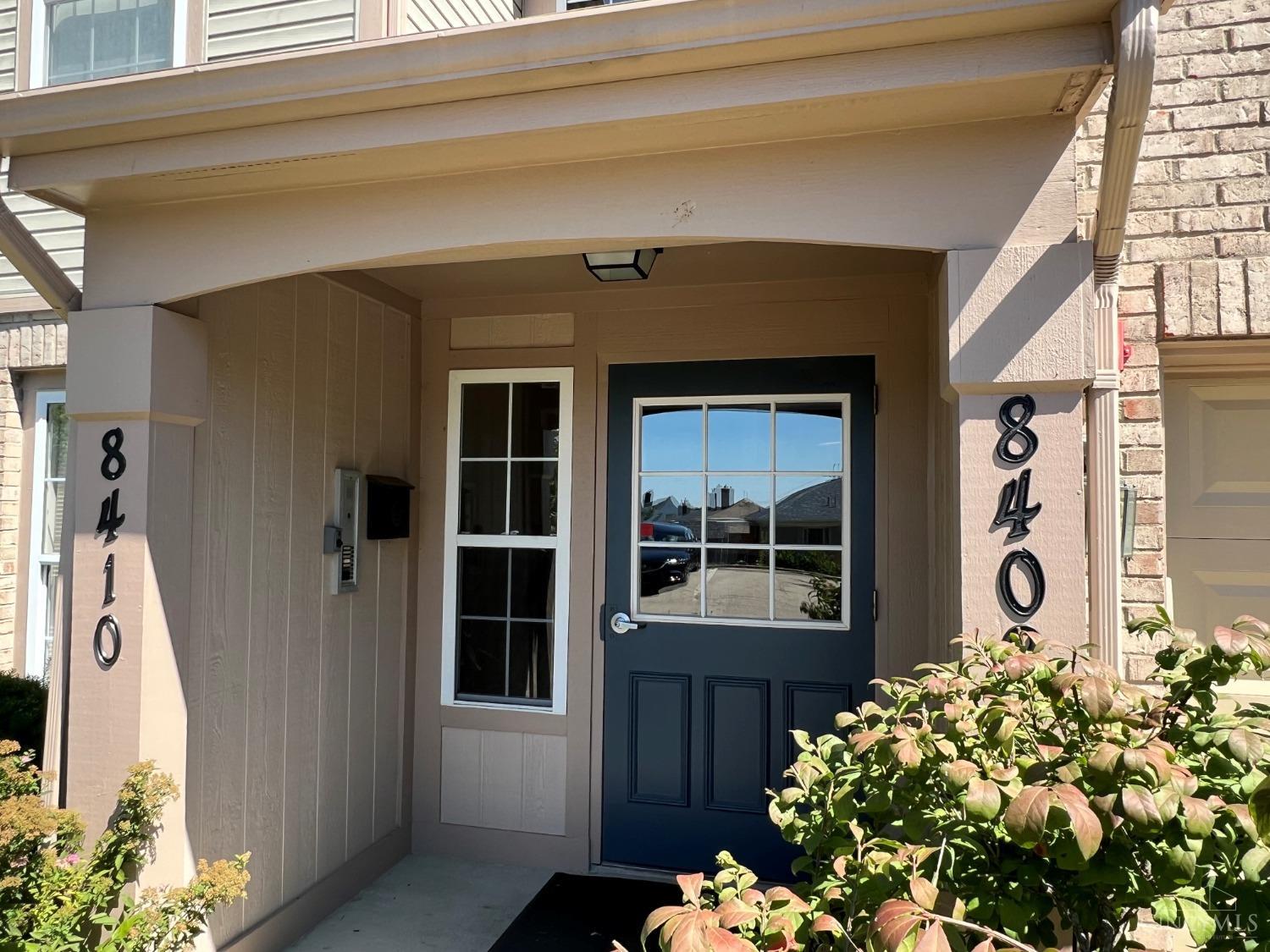 8408 Ridge Pointe Court, Unit 13 Reading, OH 45237 - Photo 2 of 39 Here's the covered exterior entrance to your condo building with secured door & intercom system.