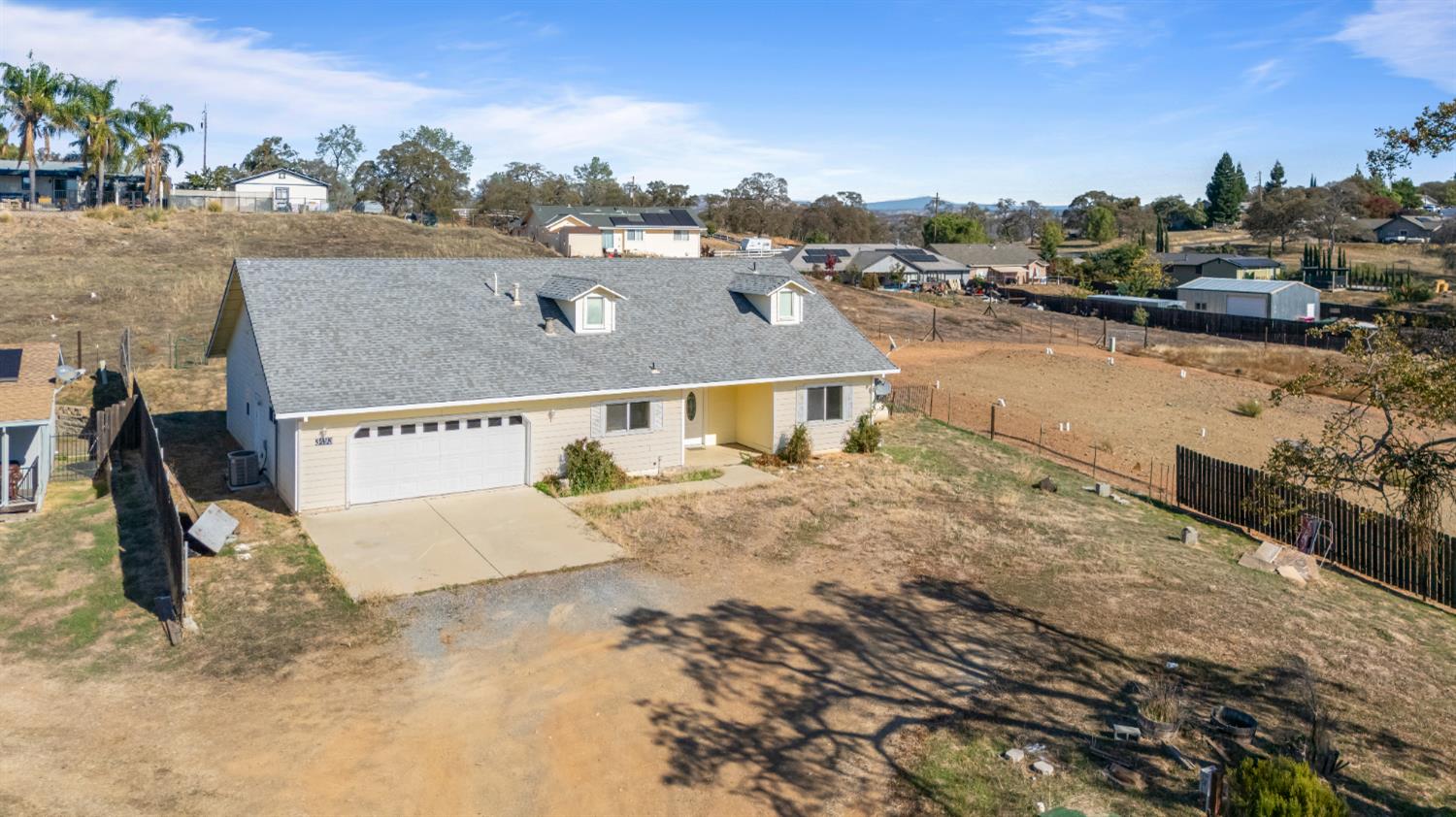 an aerial view of a house with a outdoor space