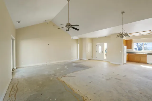 a white toilet sitting next to a shower