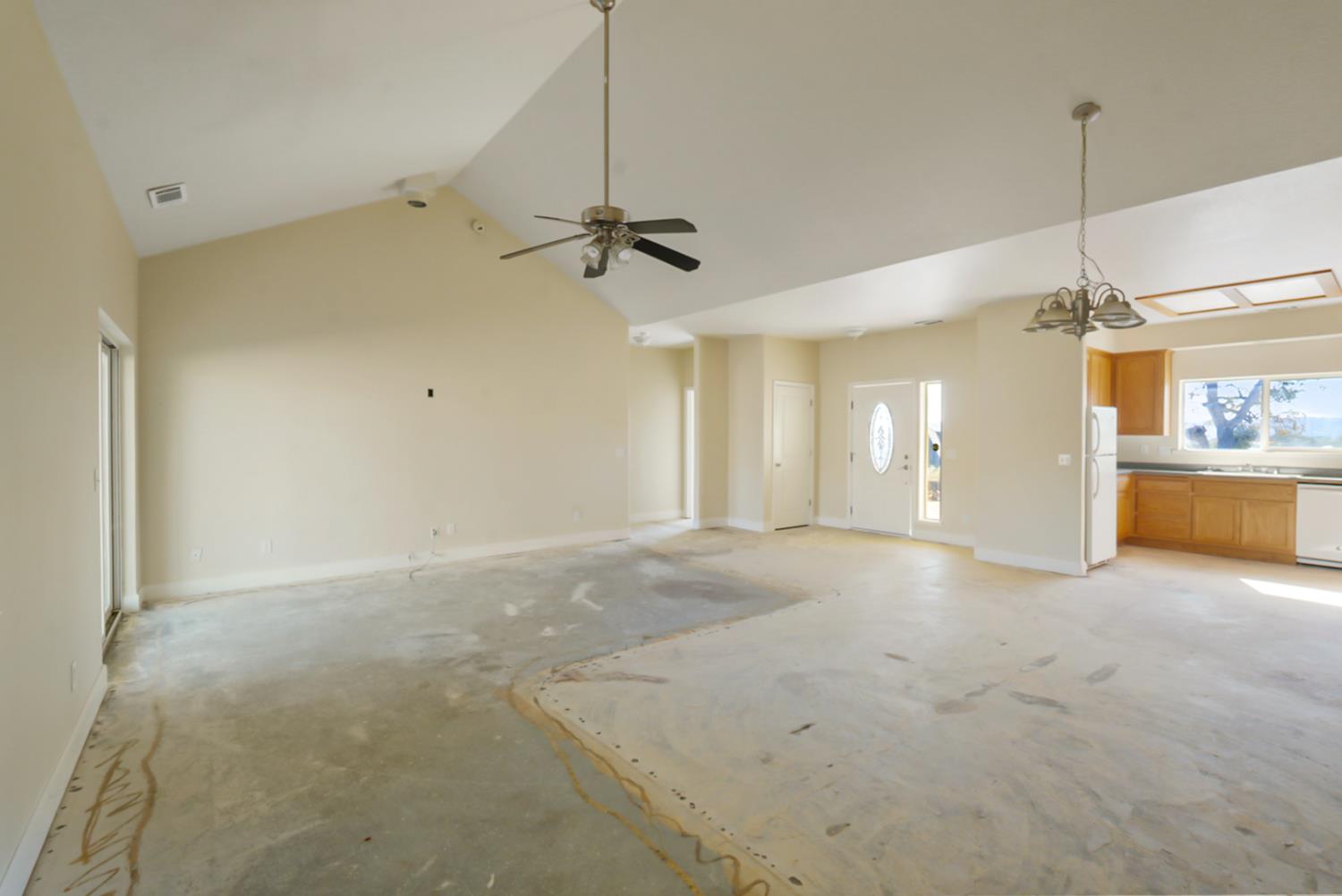 3493 Quail Hill Road Copperopolis, CA 95228 - Photo 20 of 38 a view of a room with a ceiling fan window and a kitchen view