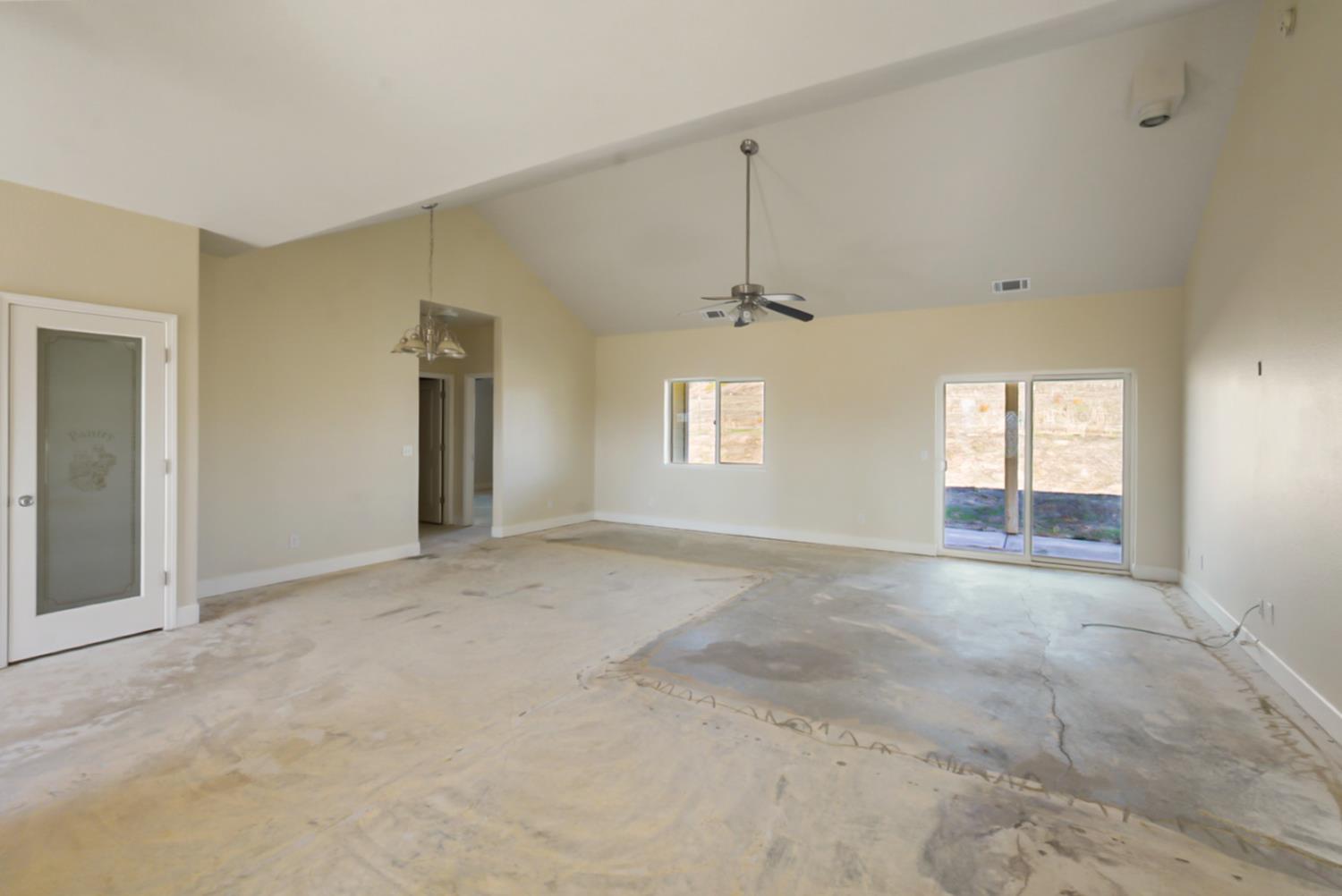 3493 Quail Hill Road Copperopolis, CA 95228 - Photo 31 of 38 an empty room with a empty space and windows